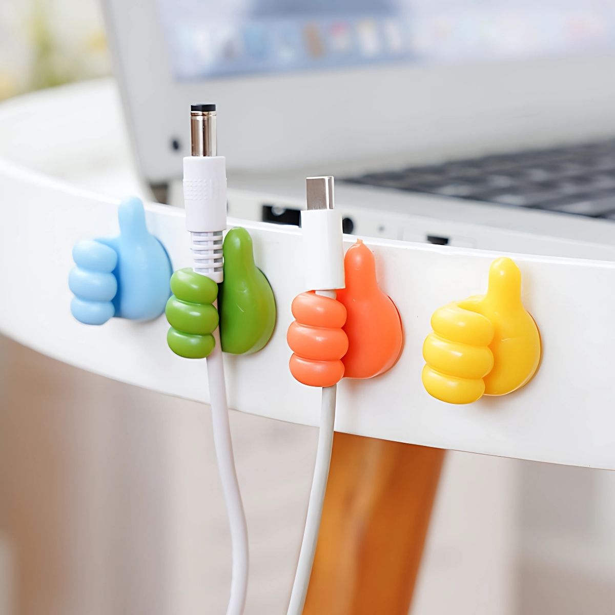 Organizador De Cables De Silicona Forma De Pulgar (Pack de 5 unid.). Colores Variados. Sujetador Para Cables Teléfono Celular Autoadhesivo