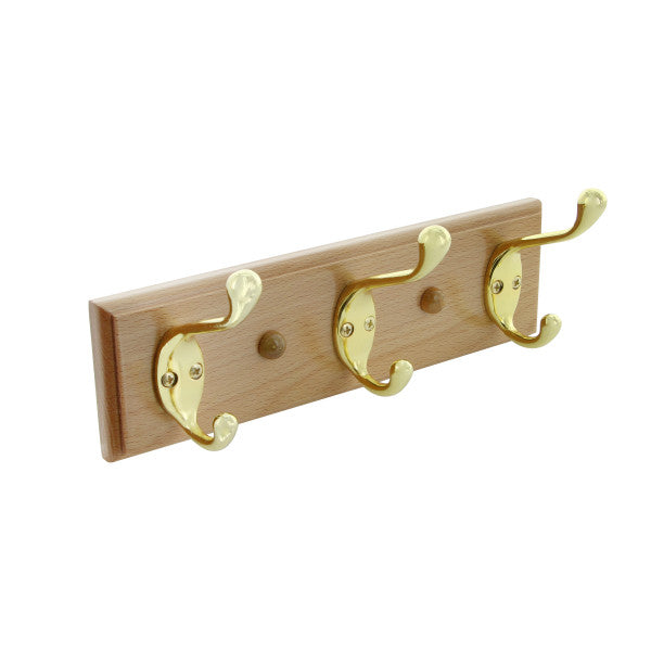 Soporte de pared con 3 ganchos. Incluye tornillos