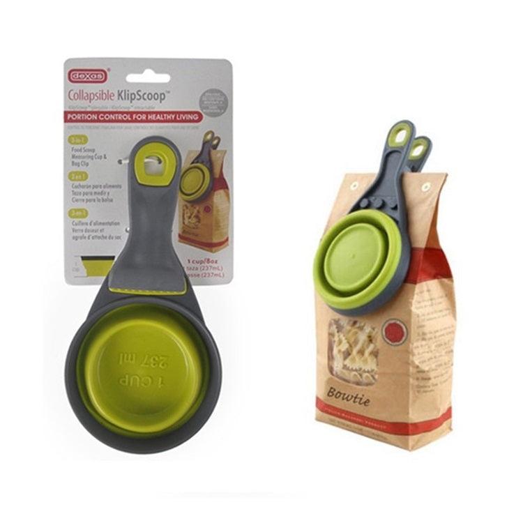Taza de medir el alimento de tus mascotas. Material silicona con pinza para cerrar bolsas.
