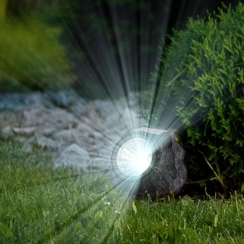 Lampara foco Luz solar para jardín en forma de roca negra. con panel solar en forma de piedra negra. Luz cálida.