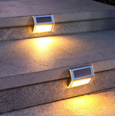 Luces LED con panel solar para exteriores. Luz cálida amarilla 3 LED en acero inoxidable de pared o escalera.