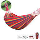 Hamaca de tela multicolor con barras de madera (260x100cm). Ideal para camping y exterior. Incluye accesorios.