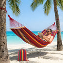 Hamaca de tela multicolor con barras de madera (260x100cm). Ideal para camping y exterior. Incluye accesorios.