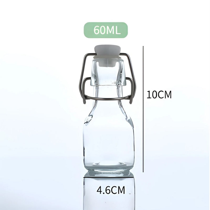 Botella De Vidrio Transparente Con Tapa Hermética Abatible. 60 ml