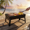 Parrillera portátil de carbón 43x29x22 cm compacta hierro con asas y patas plegables. Asador de Carbón