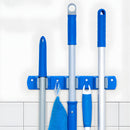Soporte Organizador De Pared Para Escobas Y Trapeadores de 3 Ranuras. Gancho autoadhesivo.