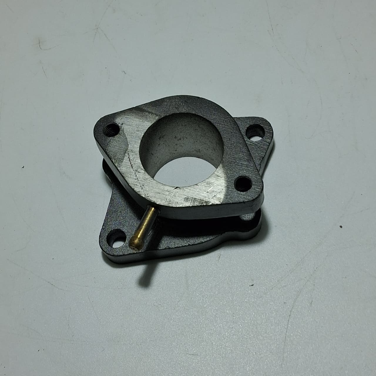 Aislante del carburador (TX200)