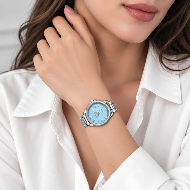 Naviforce Reloj Analógico Plateado con Esfera Azul y Correa de Acero Inoxidable, Diámetro de 34 mm, Cristal Mineral Endurecido, Calendario y Resistencia al Agua 3 ATM.