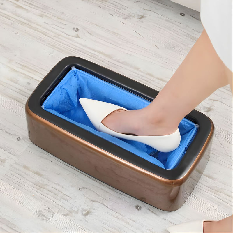 Dispensador automático de cubre zapatos protector desechable. Color bronce. Máquina dispensadora de cubre calzado por presión.