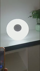 Foco LED RGB Y Luz Blanca 6500K Bluetooth Con Bocina. Lámpara Socket E27 Con Control Remoto. Bombillo Para Salas, Habitaciones, Gamers. 18W.6.3” (16CM)